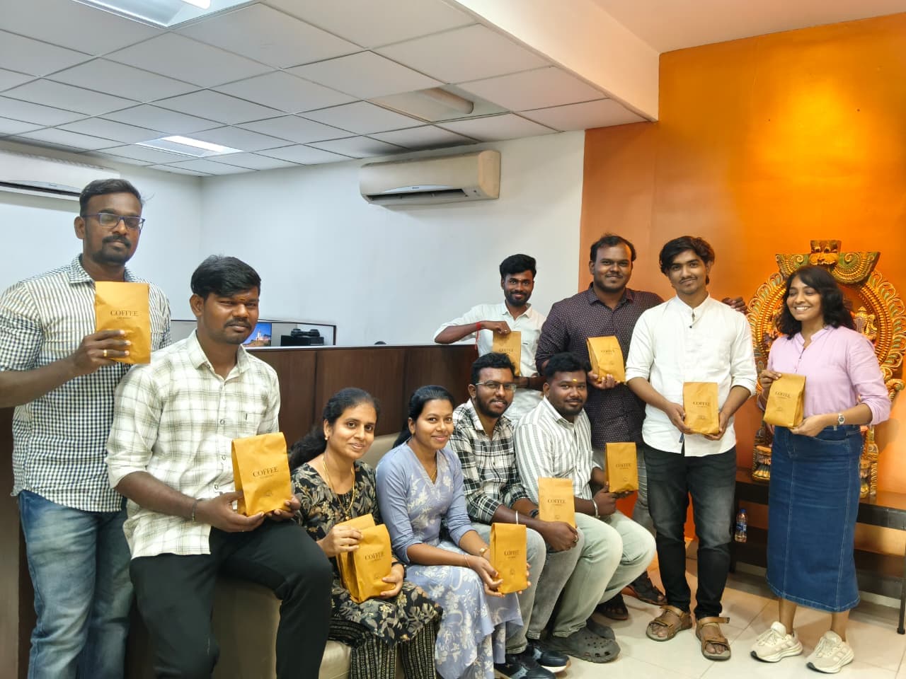 The S10 Brews team proudly holding their coffee bags